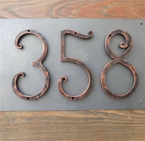 metal house numbers &|individual metal house numbers.